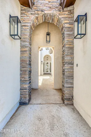 a view of hallway with wooden floor and stairs