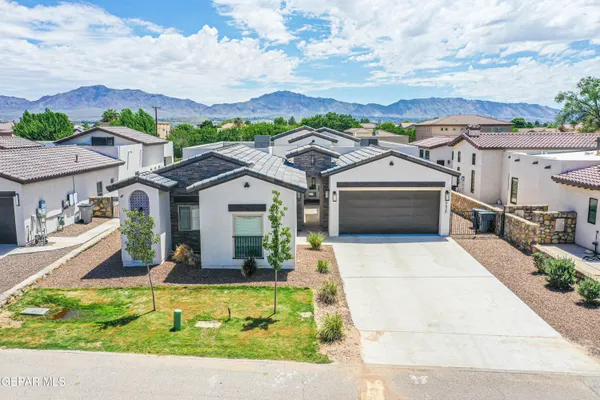 a kitchen with stainless steel appliances granite countertop wooden floor window and cabinets