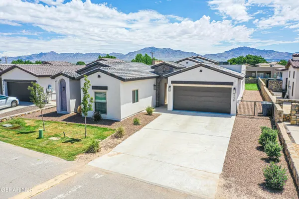 a large kitchen with stainless steel appliances lots of counter space and a sink