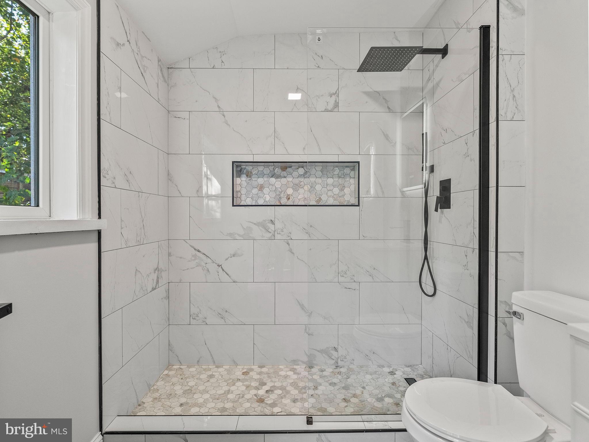 3464 Division Street Philadelphia, PA 19129 - Photo 15 of 40 a bathroom with a toilet and shower