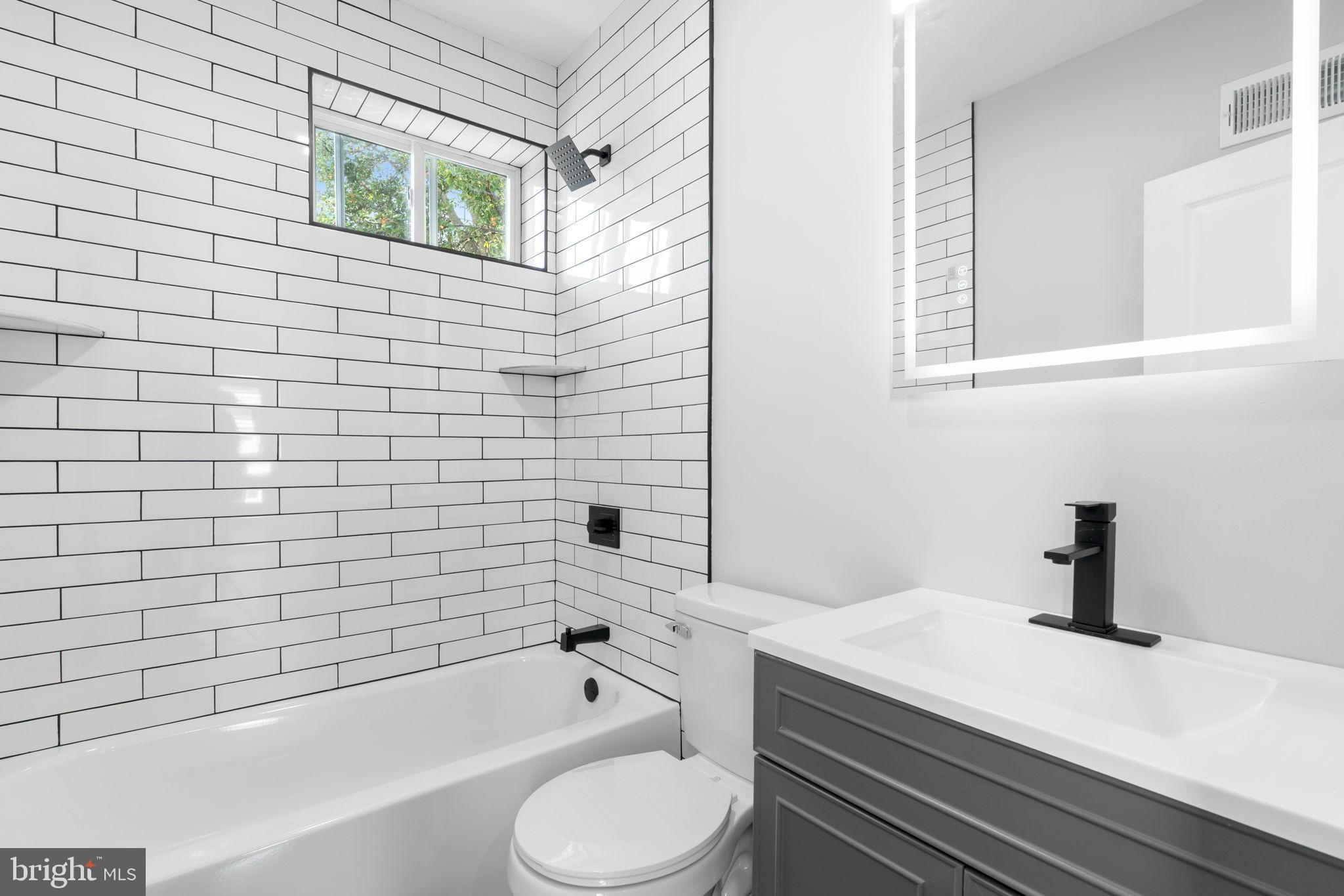 3464 Division Street Philadelphia, PA 19129 - Photo 21 of 40 a bathroom with a sink a toilet and bathtub