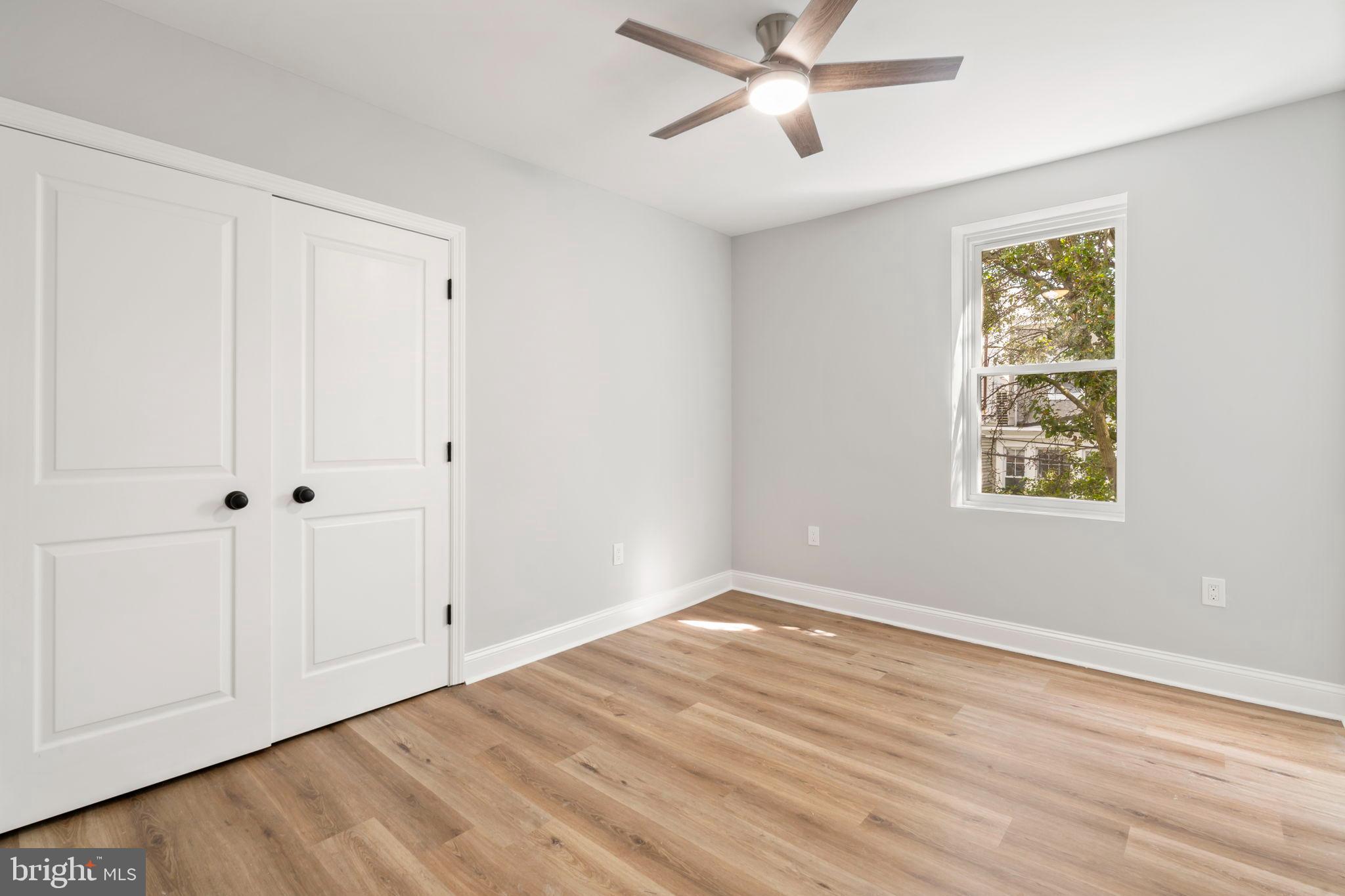 3464 Division Street Philadelphia, PA 19129 - Photo 23 of 40 a view of an empty room with wooden floor and a window