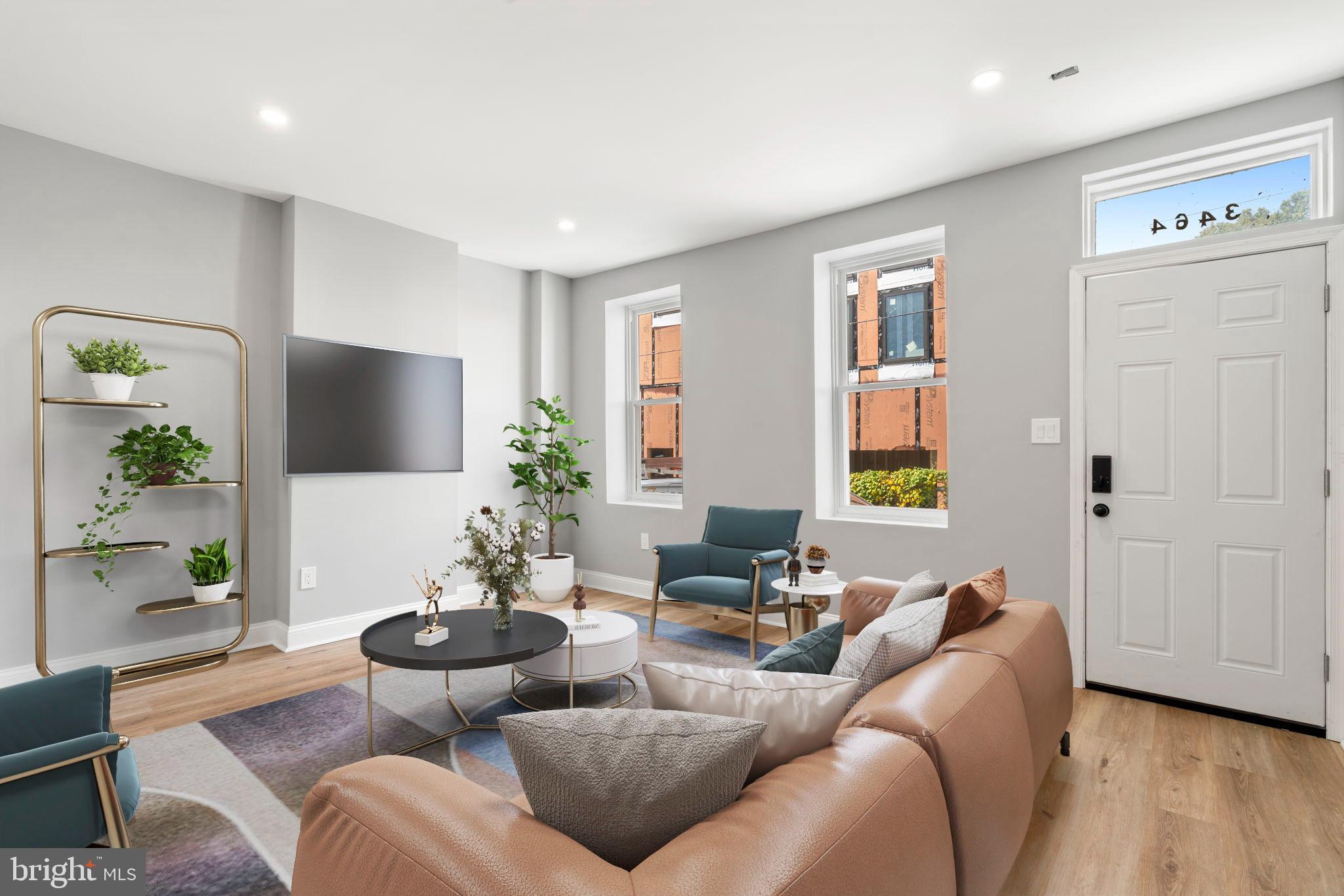 3464 Division Street Philadelphia, PA 19129 - Photo 3 of 40 a living room with furniture and a flat screen tv