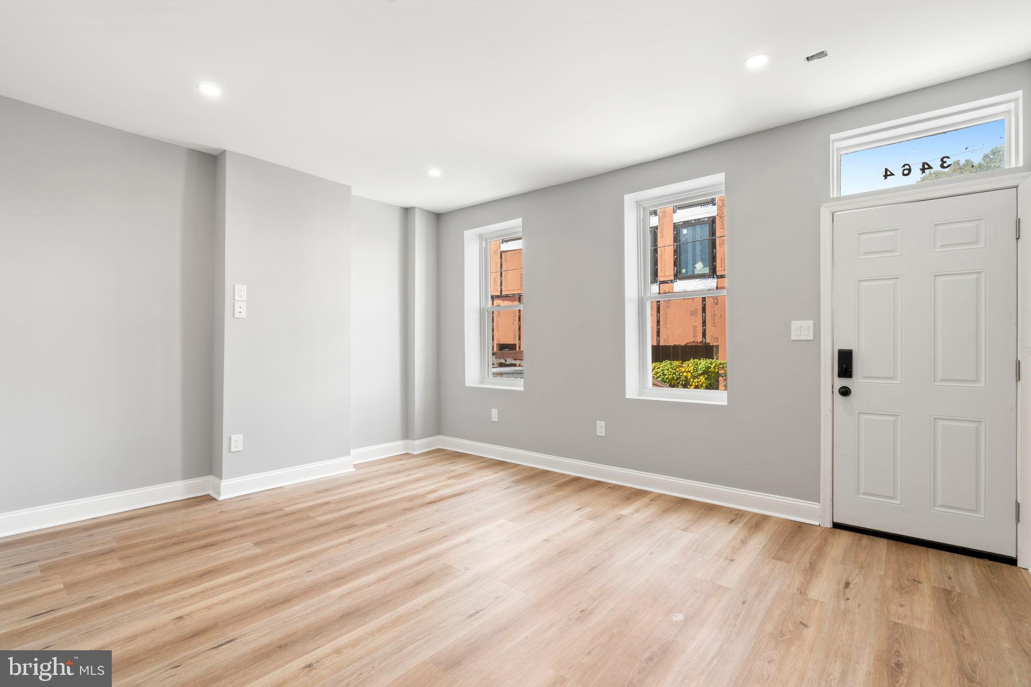 3464 Division Street Philadelphia, PA 19129 - Photo 8 of 40 a view of empty room with wooden floor and fan