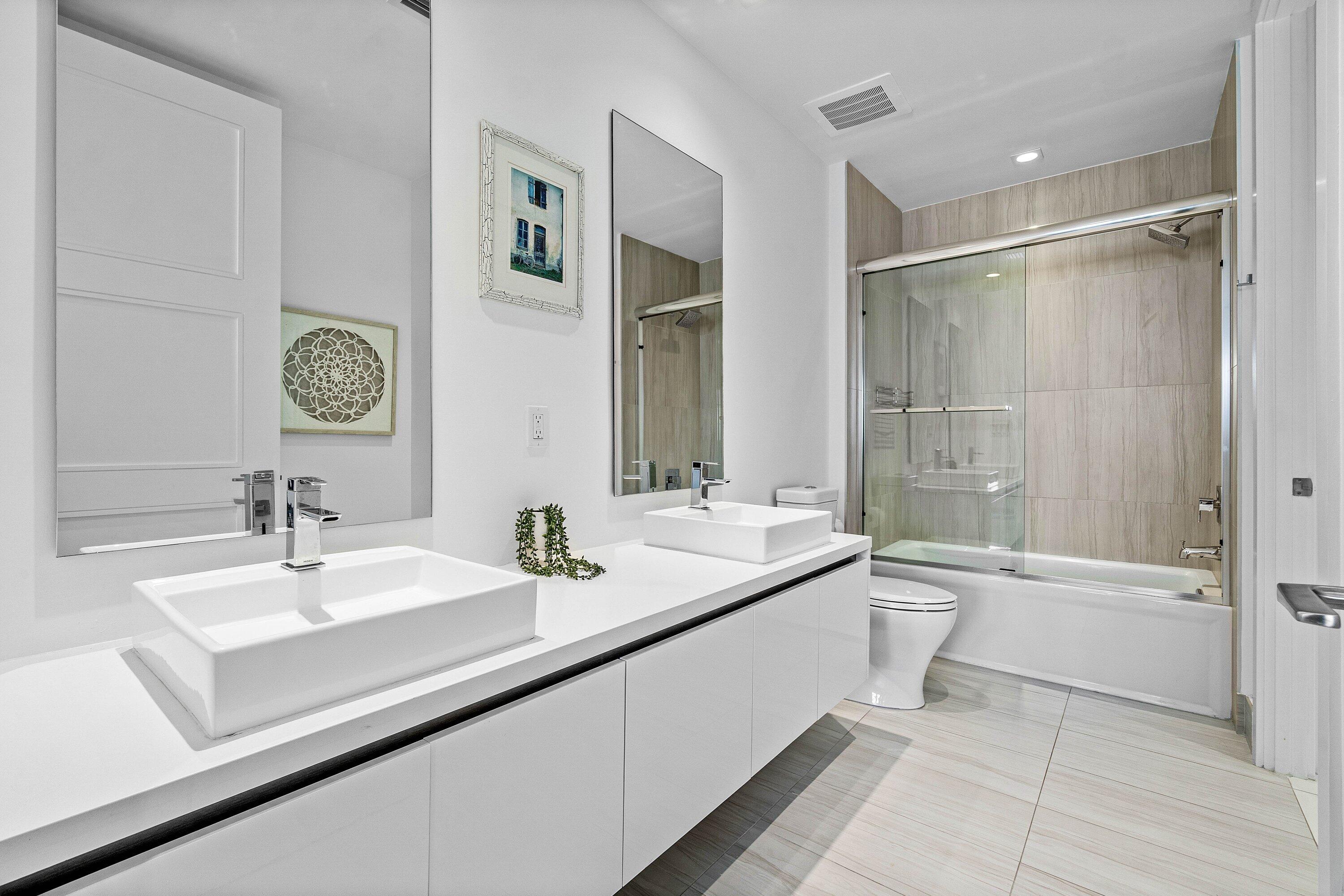 155 East Boca Raton Road, Unit 1119 Boca Raton, FL 33432 - Photo 11 of 42 a bathroom with a sink a toilet and shower