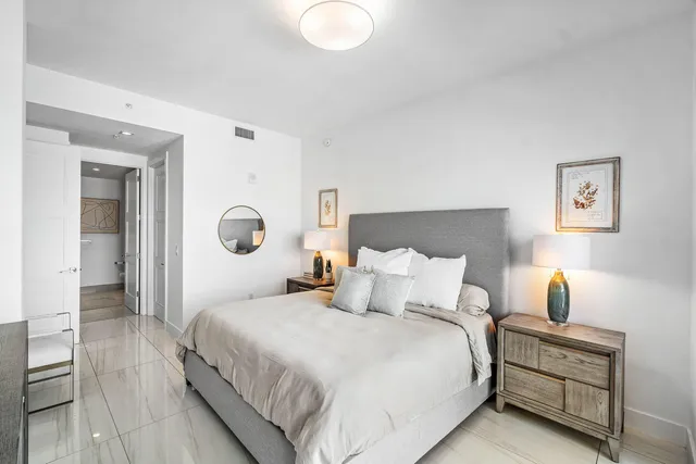 a bedroom with bed and window