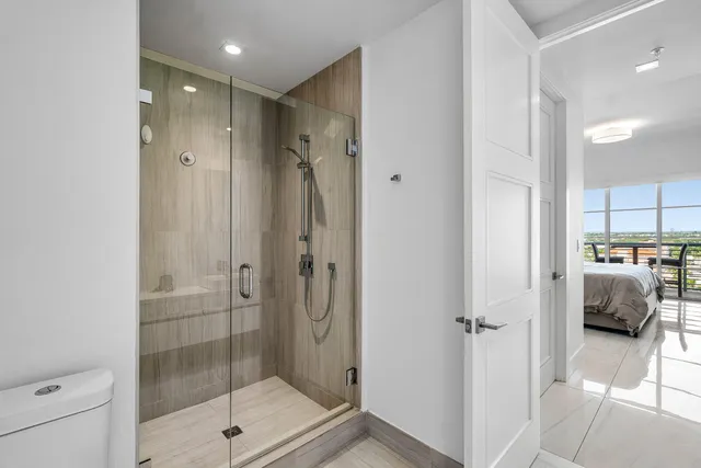 a bathroom with a shower and a sink