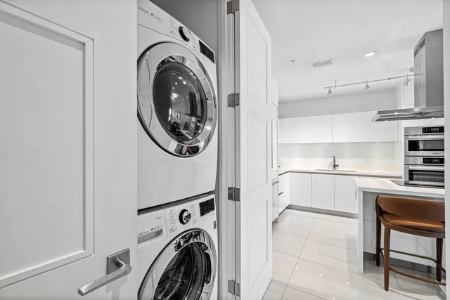 a view of a kitchen with washer and dryer
