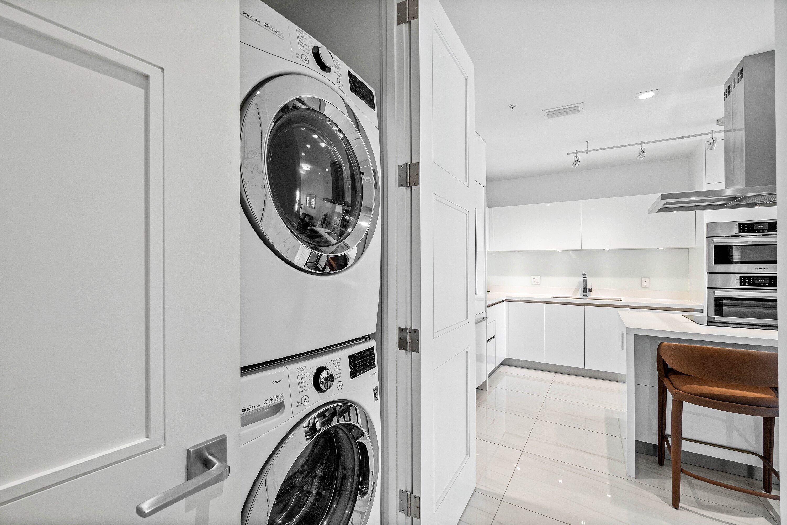 155 East Boca Raton Road, Unit 1119 Boca Raton, FL 33432 - Photo 16 of 42 a view of a kitchen with washer and dryer