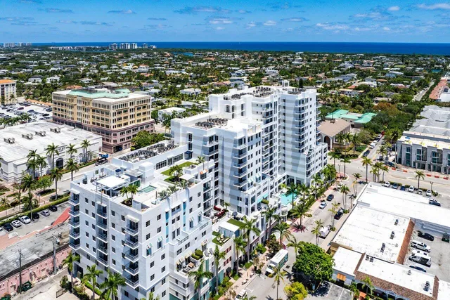 an aerial view of a city with ocean view