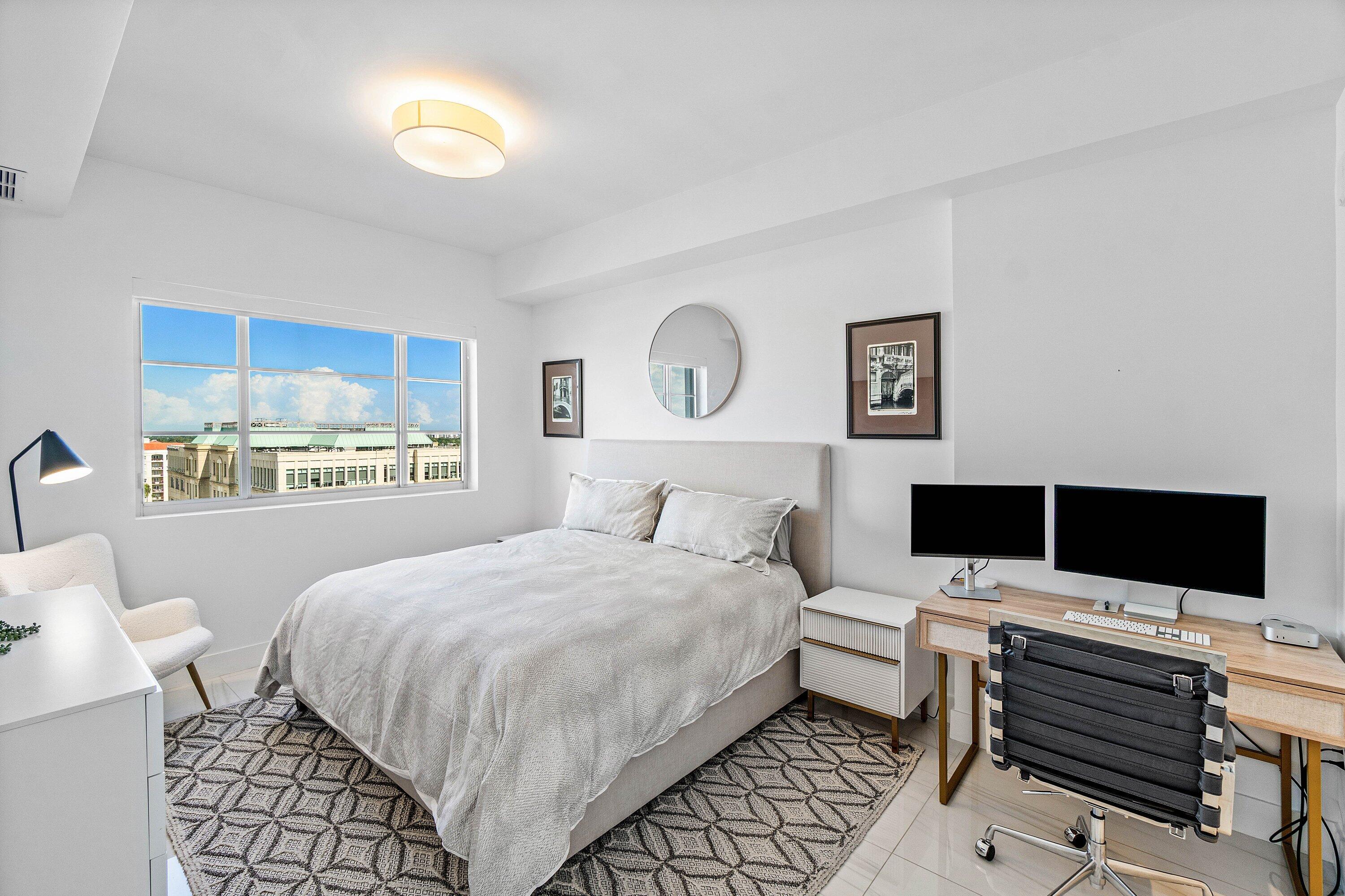 155 East Boca Raton Road, Unit 1119 Boca Raton, FL 33432 - Photo 9 of 42 a bedroom with a bed and a flat screen tv