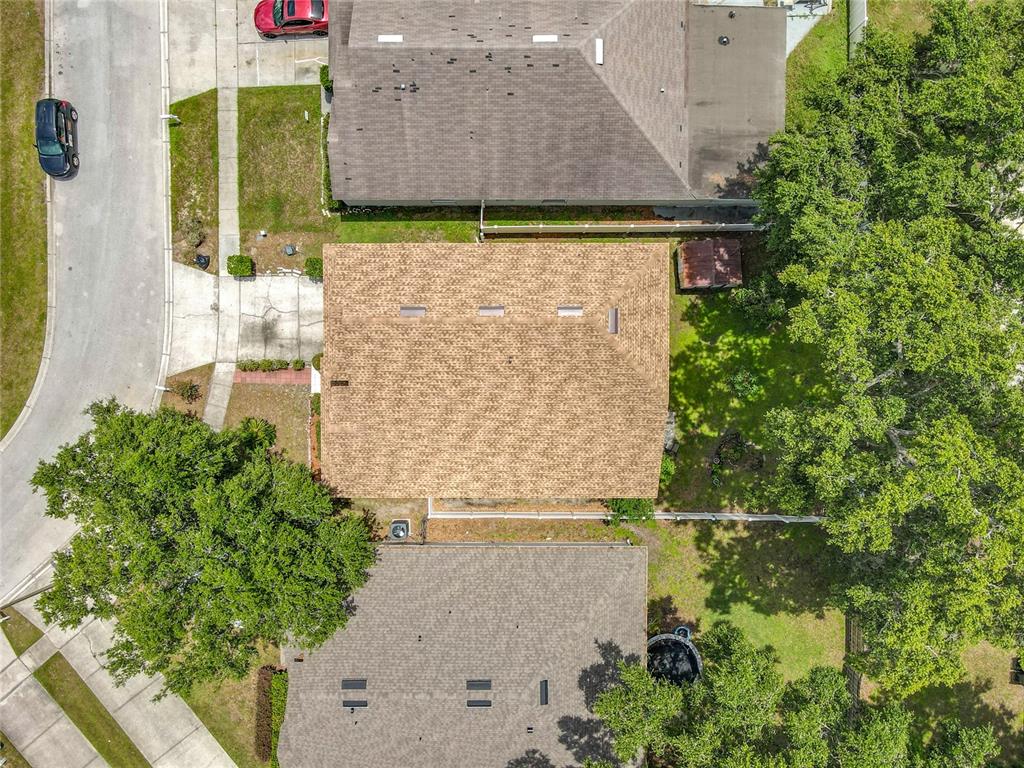 7939 Riffle Lane Orlando, FL 32818 - Photo 46 of 52 a aerial view of a house with a yard