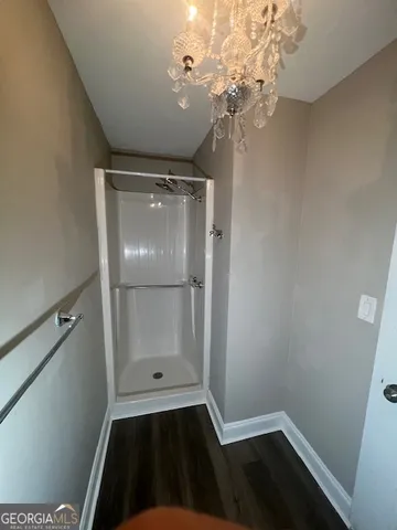 a view of a hardwood floor in closet