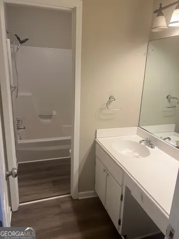 a view of a refrigerator in kitchen and wooden floor