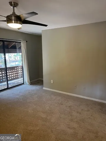 a view of an empty room with a window