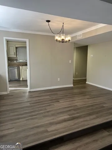 a view of livingroom and hardwood floor