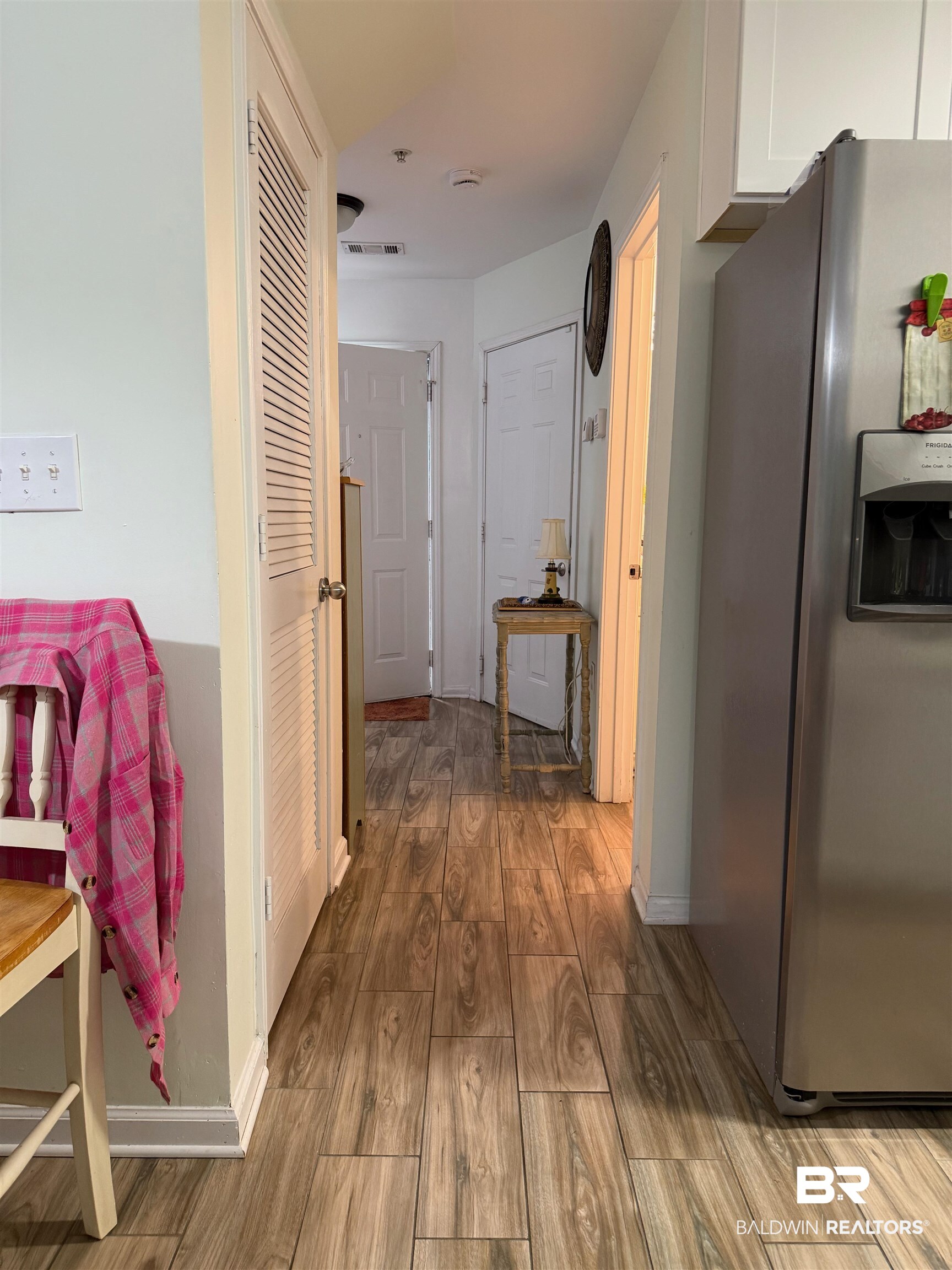 1517 Regency Road, Unit 71 Gulf Shores, AL 36542 - Photo 24 of 26 Corridor featuring wood finish floors and baseboards