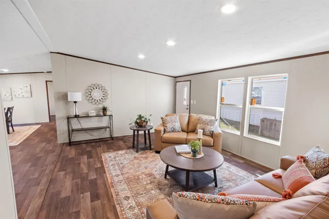 a living room with furniture and a table