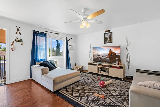 an aerial view of multiple houses with yard