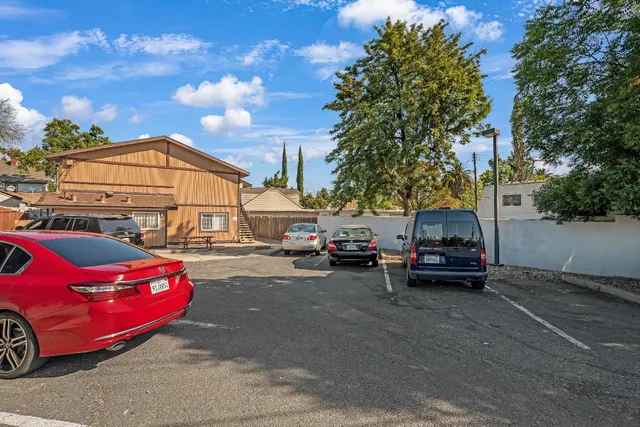 a view of a balcony with wooden floor