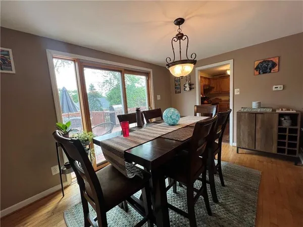 a dining room with furniture window wooden floor