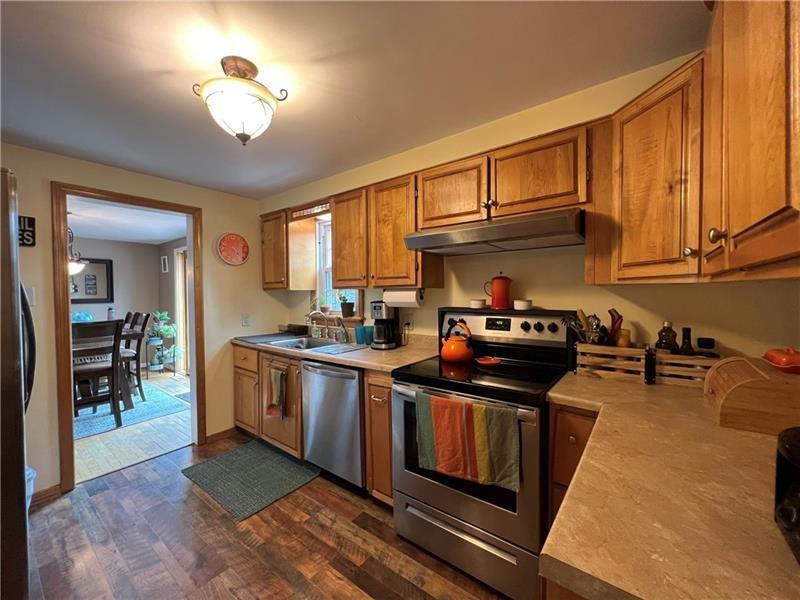 117 Virginia Road Pittsburgh, PA 15237 - Photo 16 of 37 a kitchen with stainless steel appliances granite countertop a stove a sink and a microwave