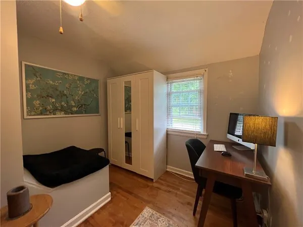 a living room with furniture and a lamp