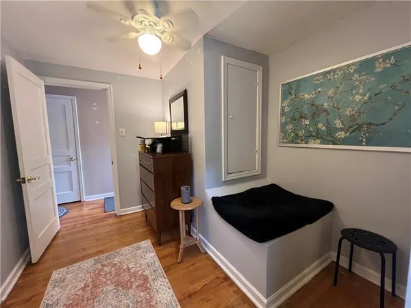 a kitchen with a refrigerator and a stove top oven