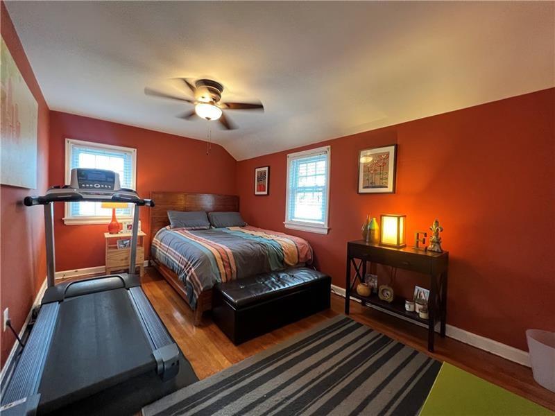 117 Virginia Road Pittsburgh, PA 15237 - Photo 24 of 37 a bedroom with a bed and wooden floor