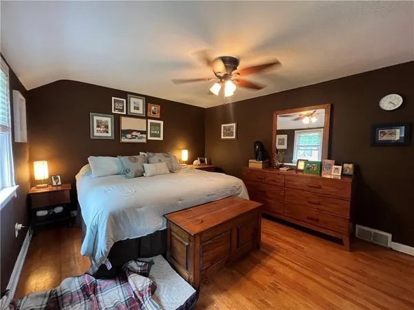 a bed room with a bed and a chandelier