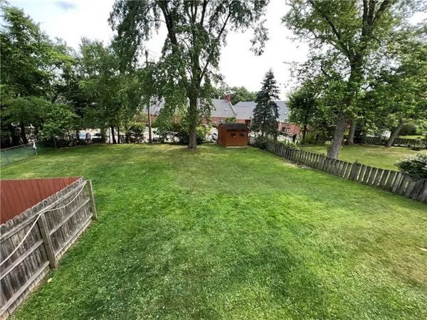 a view of a garden with houses