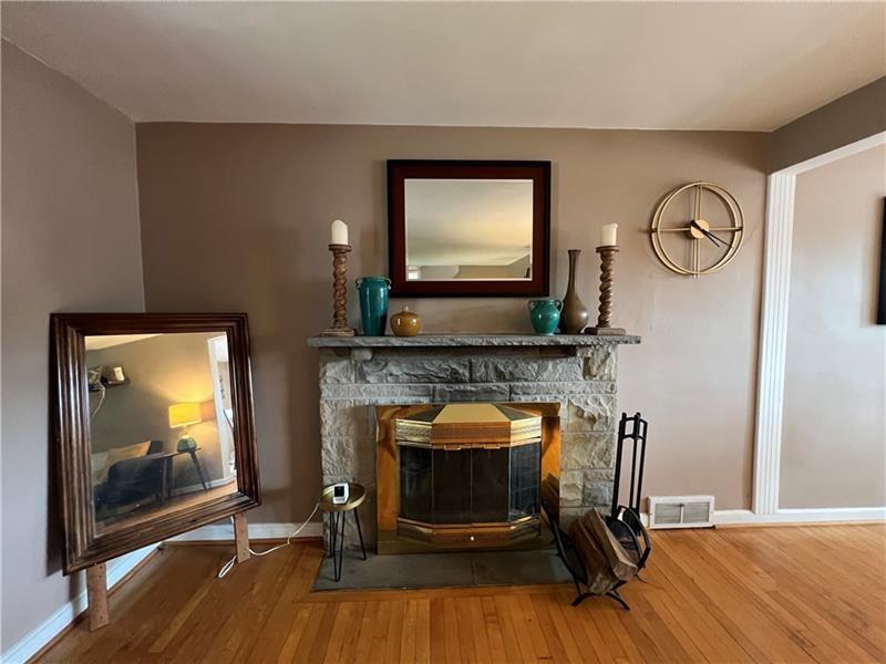 117 Virginia Road Pittsburgh, PA 15237 - Photo 9 of 37 a living room with furniture and a fireplace