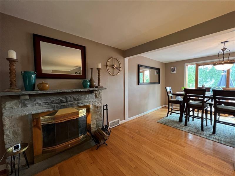 117 Virginia Road Pittsburgh, PA 15237 - Photo 10 of 37 a living room with furniture a flat screen tv and a fireplace