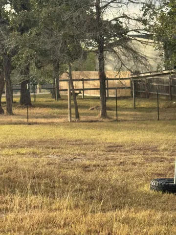 a bathroom with a toilet a sink and a window