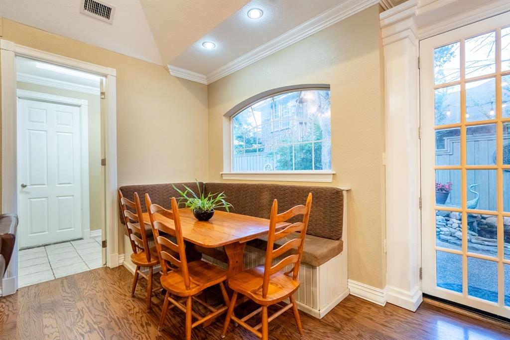 1450 Meandering Way Rockwall, TX 75087 - Photo 14 of 33 a dining room with furniture and wooden floor