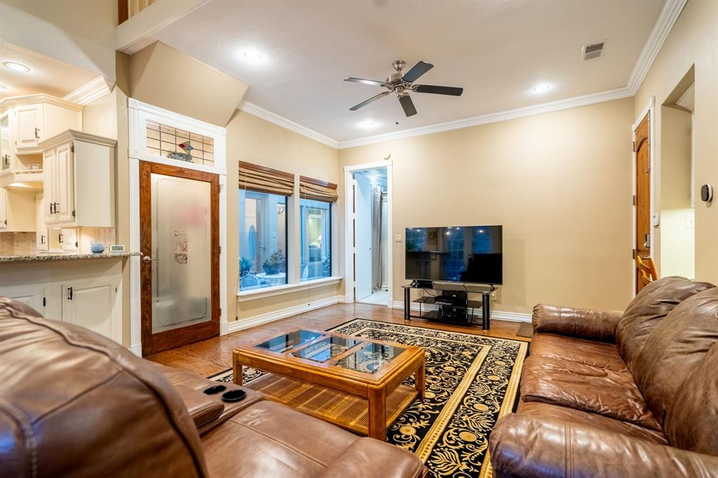 1450 Meandering Way Rockwall, TX 75087 - Photo 16 of 33 a living room with furniture and a flat screen tv