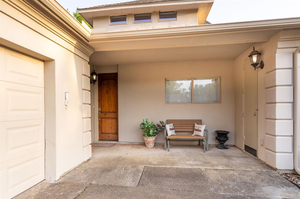 1450 Meandering Way Rockwall, TX 75087 - Photo 30 of 33 a living room with a couch and a potted plant