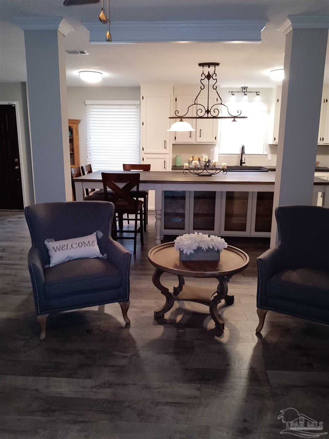 5837 Hermitage Circle Milton, FL 32570 - Photo 12 of 31 a living room with furniture and a table