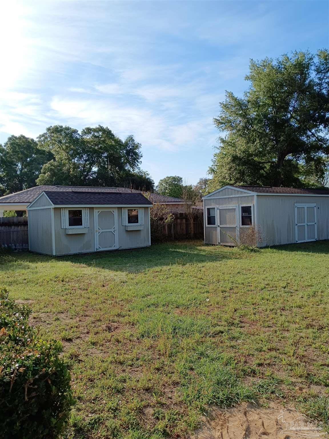 5837 Hermitage Circle Milton, FL 32570 - Photo 28 of 31 12x32 with tool storage + workbench 10x16 utility