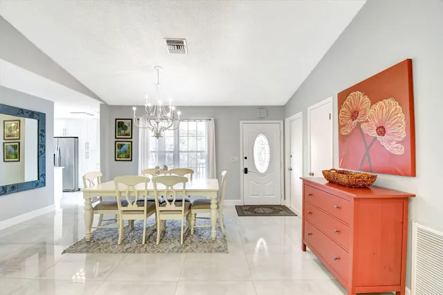 a view of a dining room with furniture window and outside view