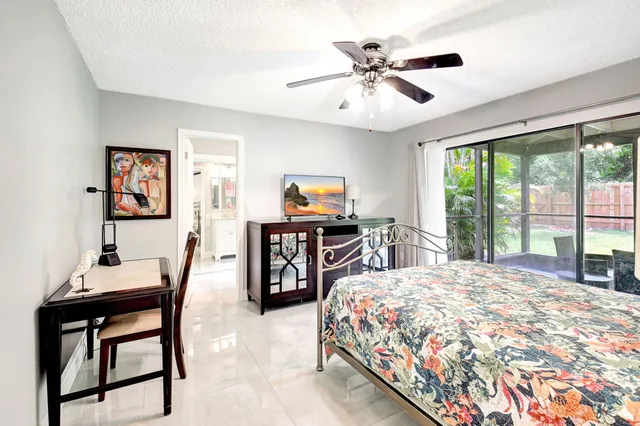 a bedroom with a bed and a television