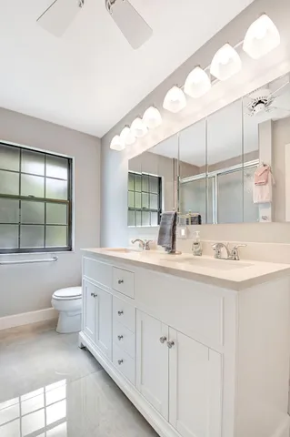 a bathroom with a glass shower door