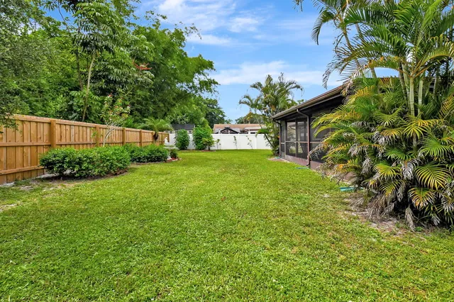 a backyard of a house with lots of green space