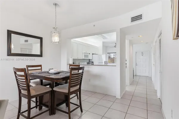 a view of a dining room and livingroom with furniture