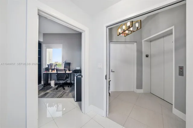 a view of a livingroom and a dining room with furniture