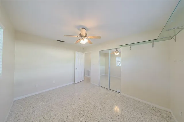 a view of a house with backyard porch and wooden floor