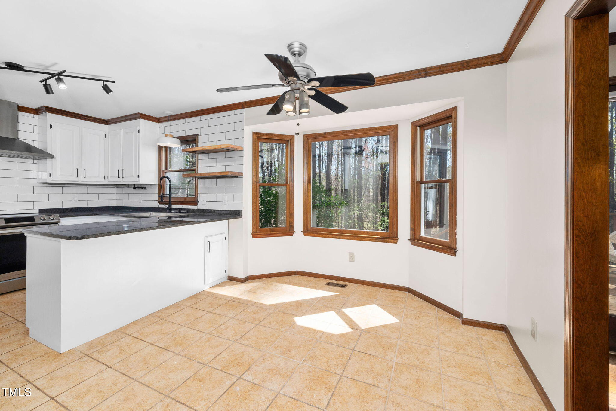 7917 Blaney Franks Road Apex, NC 27539 - Photo 8 of 50 a view of a kitchen with a sink and cabinets