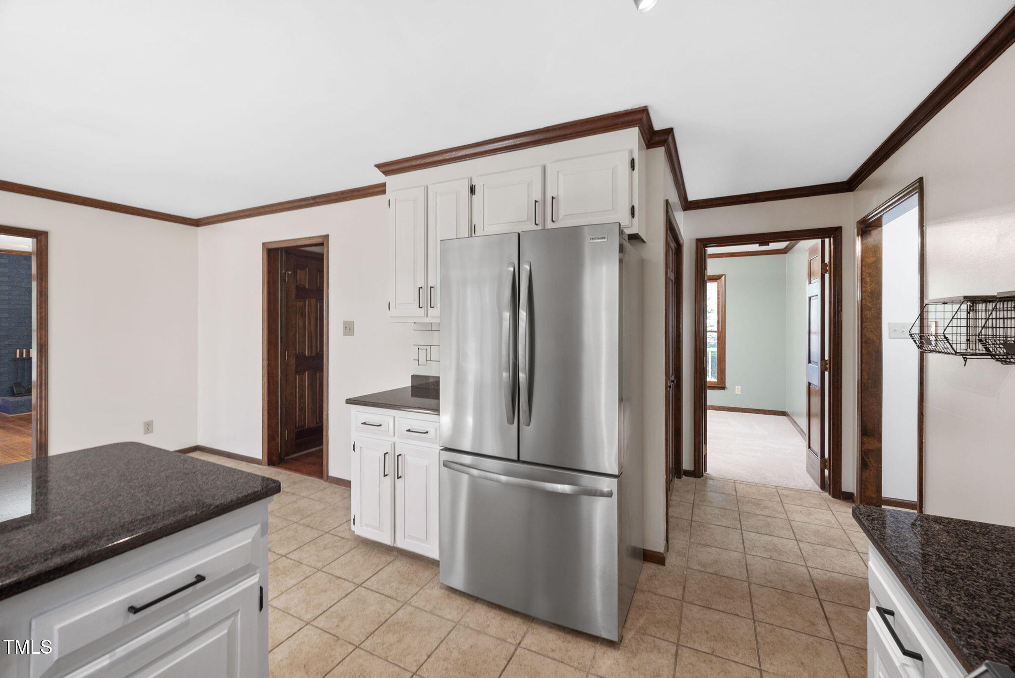 7917 Blaney Franks Road Apex, NC 27539 - Photo 12 of 50 a kitchen with stainless steel appliances granite countertop a refrigerator and a sink