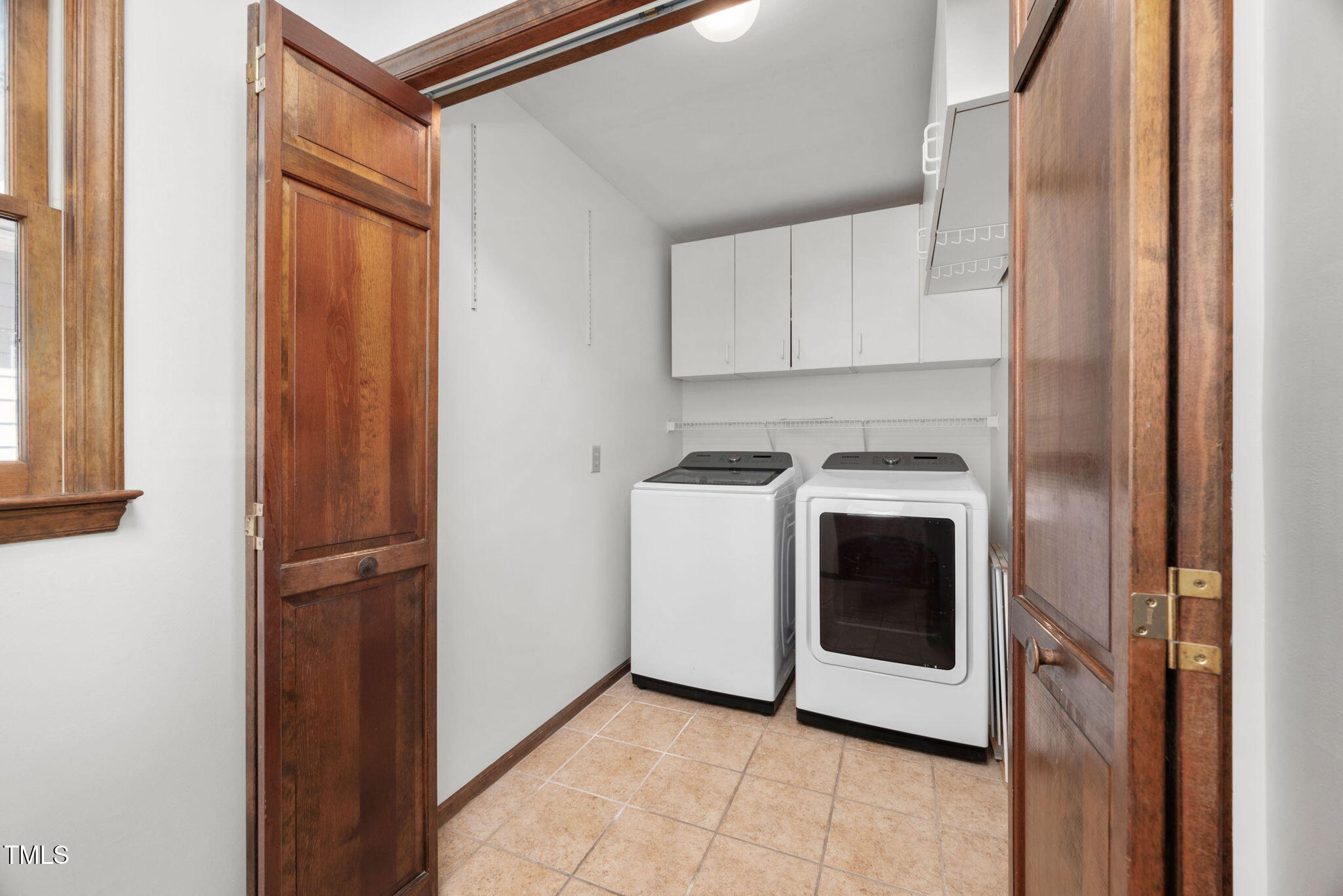7917 Blaney Franks Road Apex, NC 27539 - Photo 13 of 50 a utility room with washer and dryer