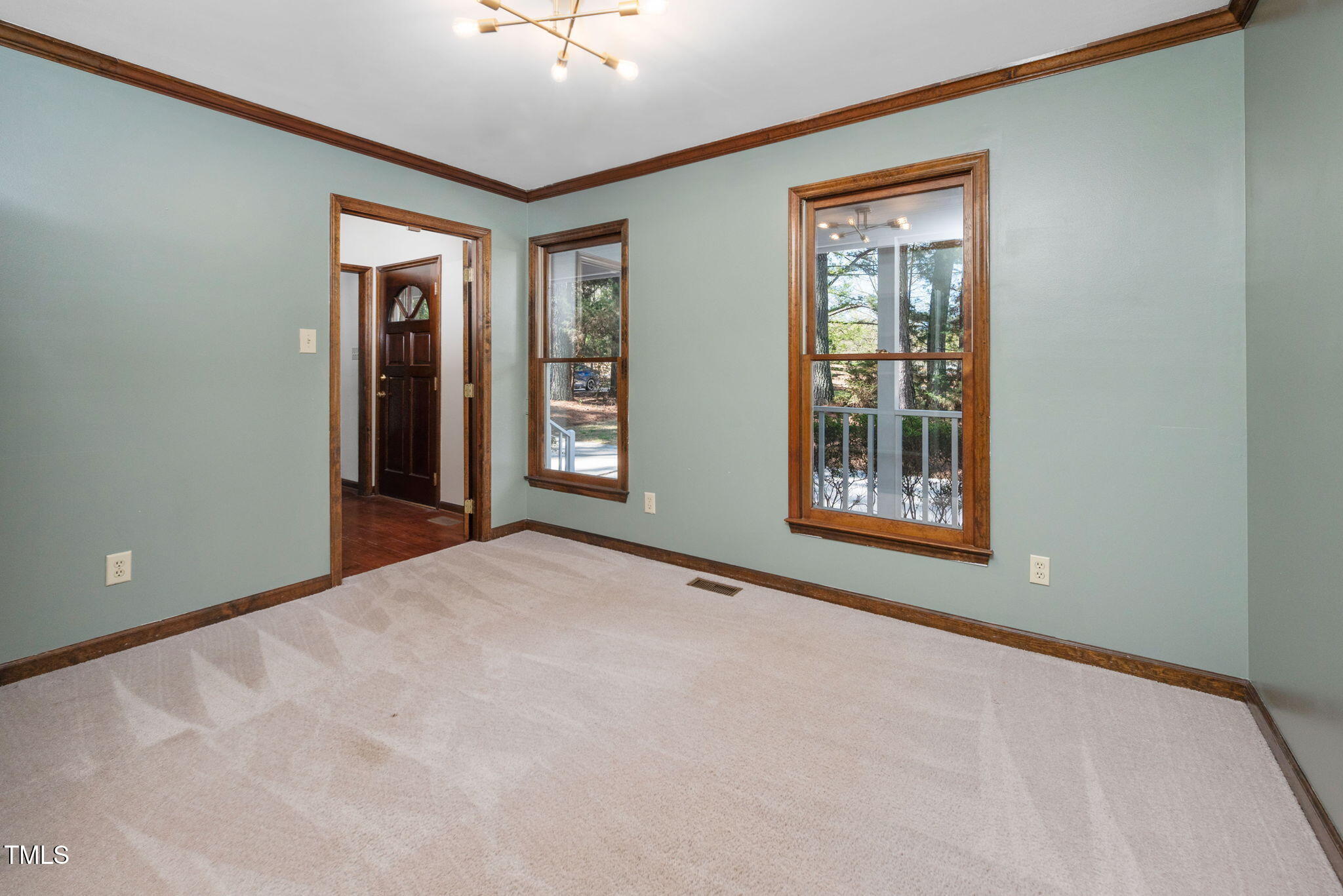 7917 Blaney Franks Road Apex, NC 27539 - Photo 14 of 50 a view of an empty room with window and closet area